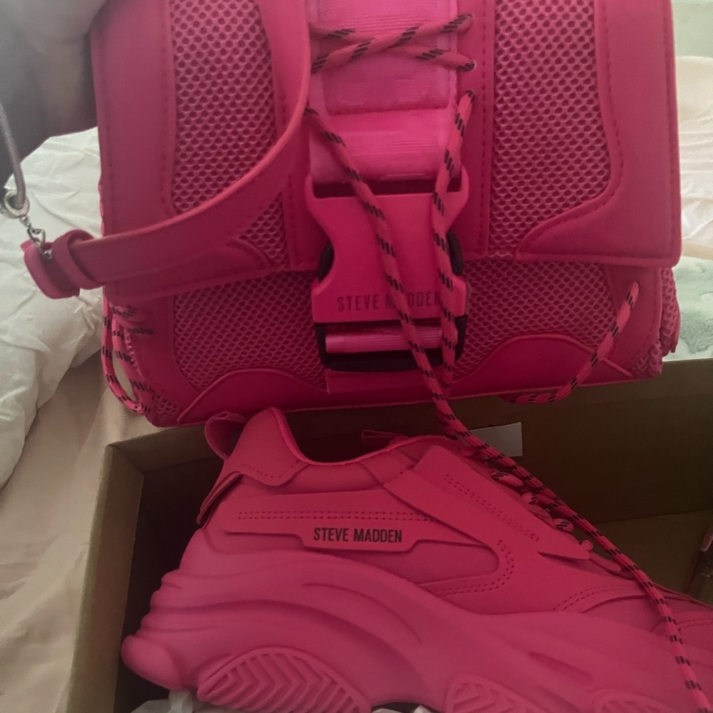 Brand new.  Still in box Steve Madden shoes and matching purse.